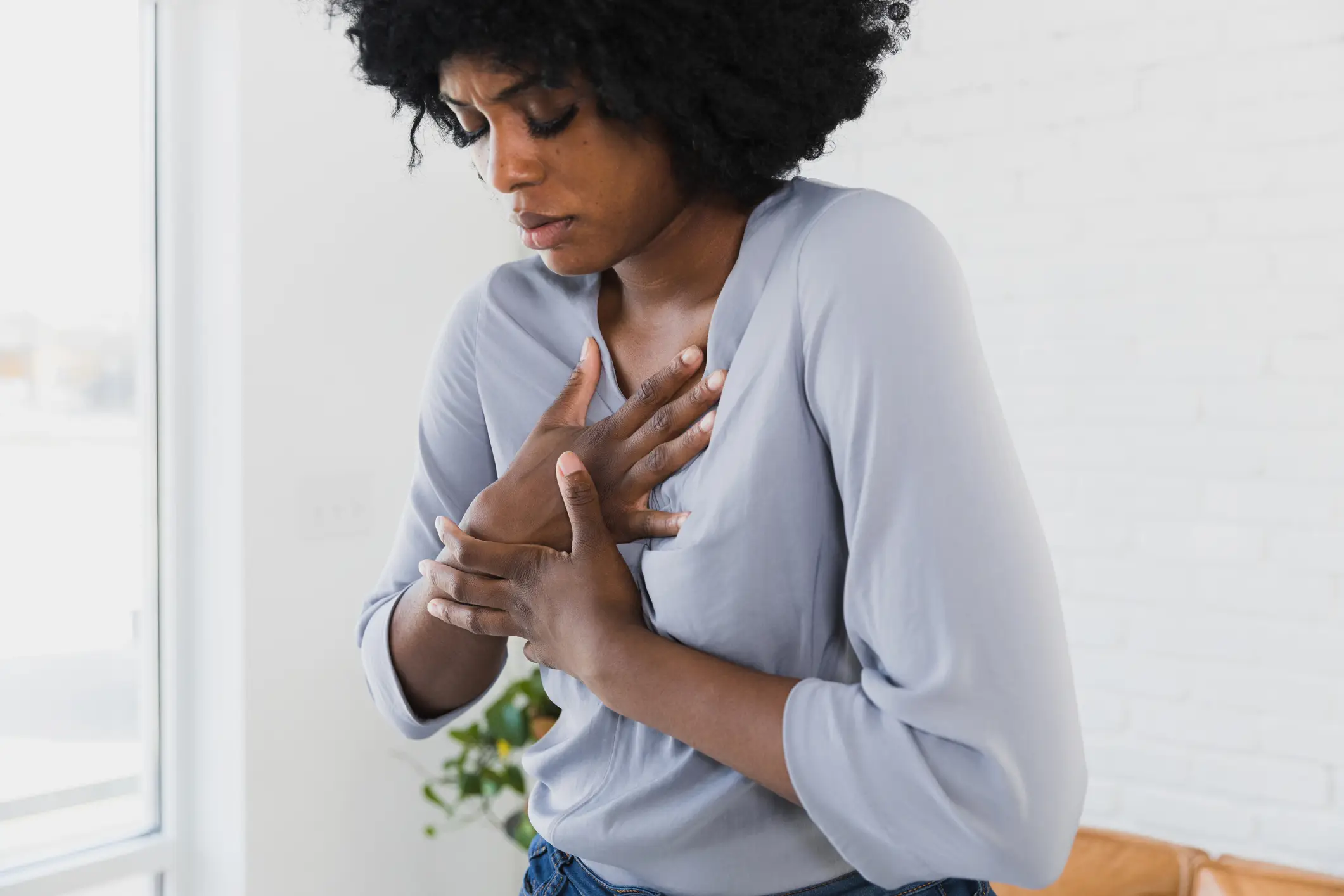 Chest pain is the most common heart attack symptom. (SDI Productions / Getty Images)