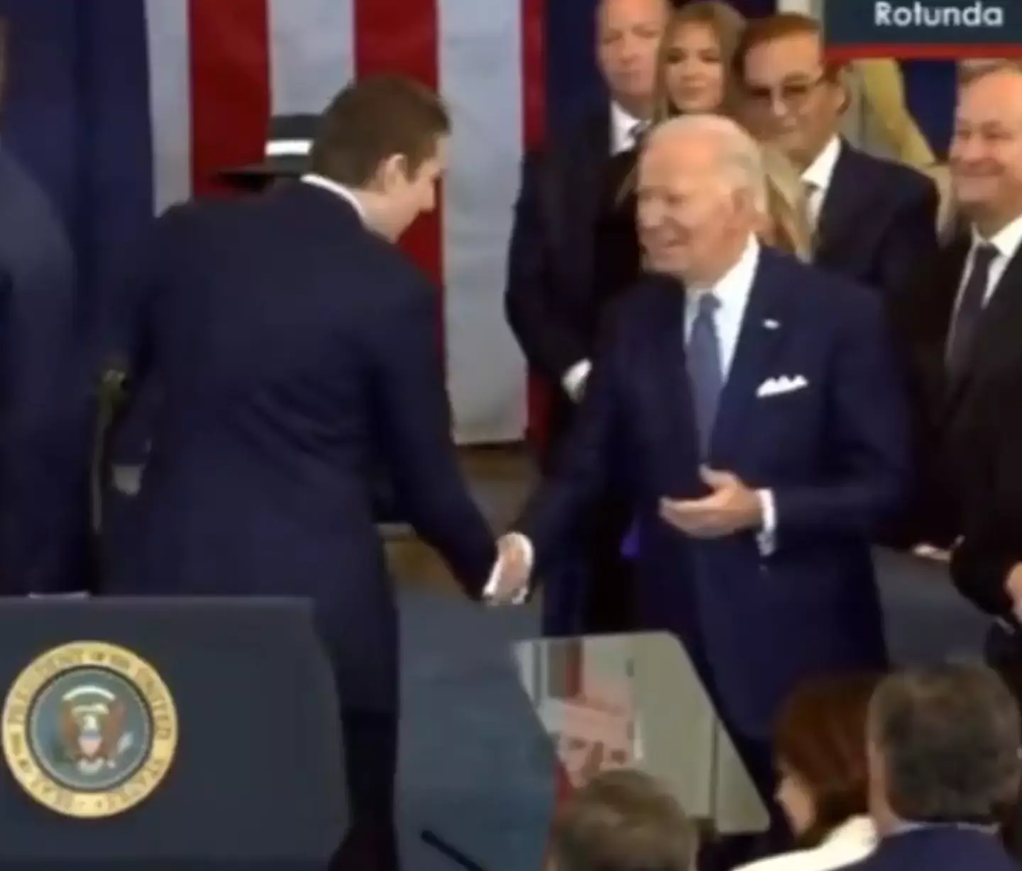 Barron shook hands with Biden before appearing to make a comment in his ear (X)