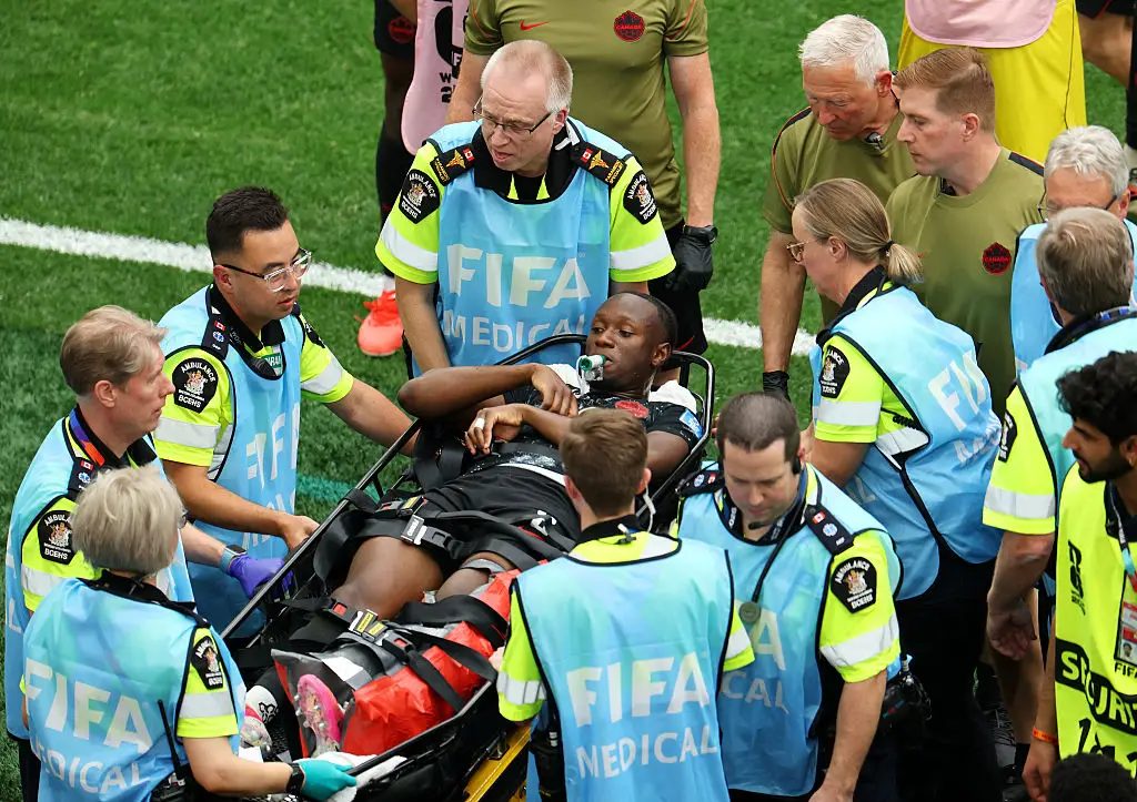 The midfielder was stretchered off following the injury (Emilee Chinn/Getty Images)
