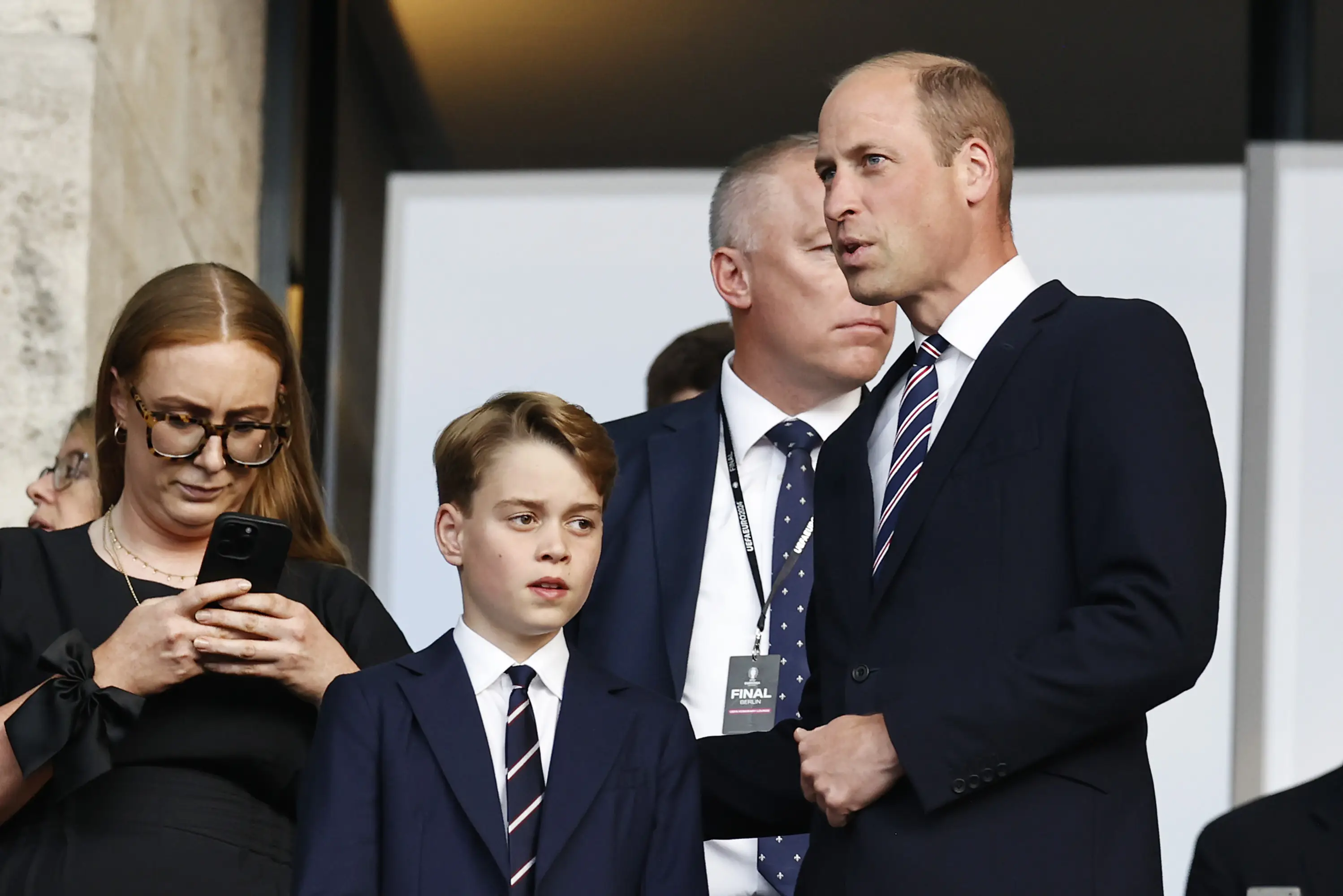 The pair wore matching suits to England's game against Spain on Sunday. (ANP via Getty Images)