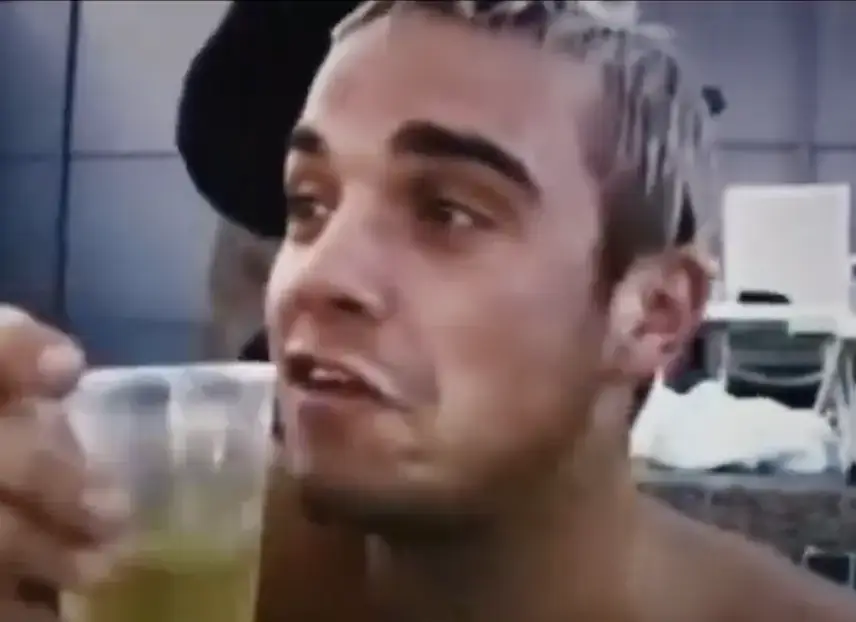 The documentary showed sad scenes of Robbie while in the band. (BBC)