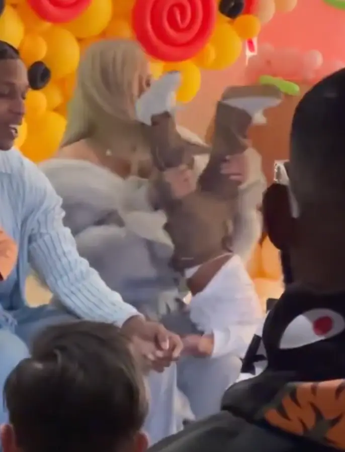 Rhianna was seen playfully dangling her son at his birthday party. (Instagram/@itsjazzy.b)