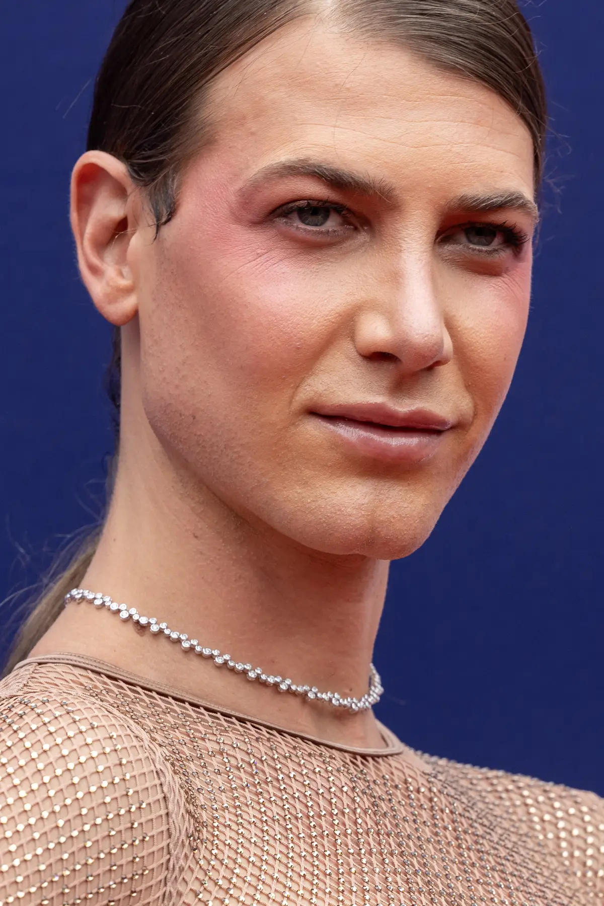 Aussie model, Christian Wilkins, has issued a response to critics slamming him over his 'nude' dress.