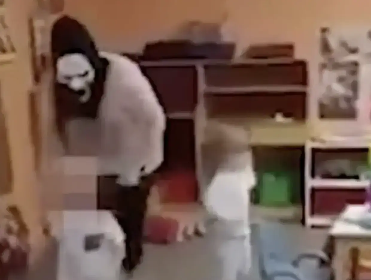 Five workers have been charged with child abuse after the video was shared online.