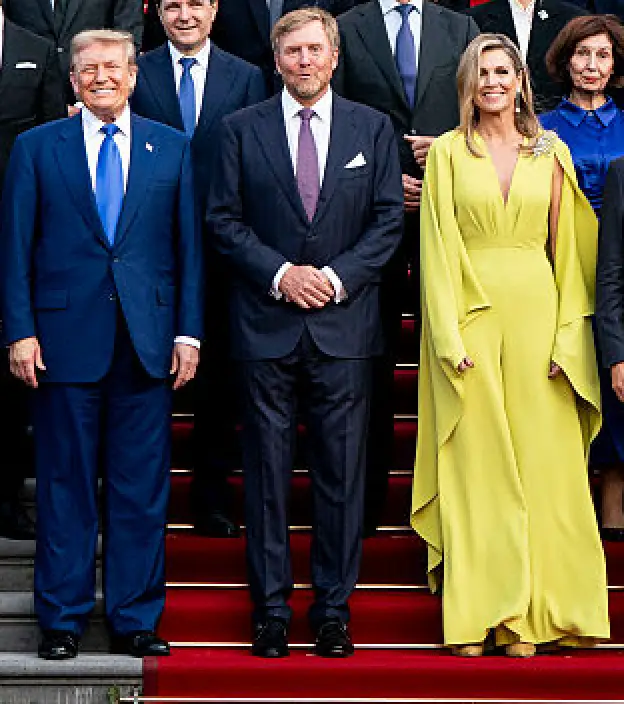 Trump, 6'3", standing next to the King and Queen of the Netherlands who are reportedly 6'2" and 5'8" respectively (Pool / Pool / Getty Images)