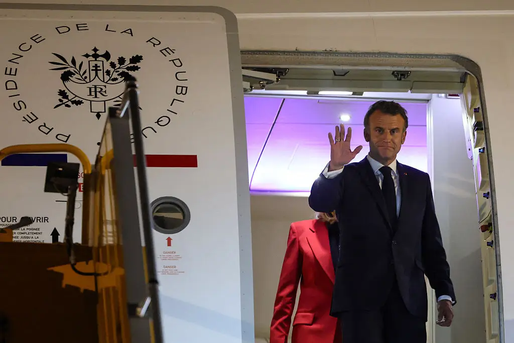 Macron waved to the press (LUDOVIC MARIN/AFP via Getty Images)