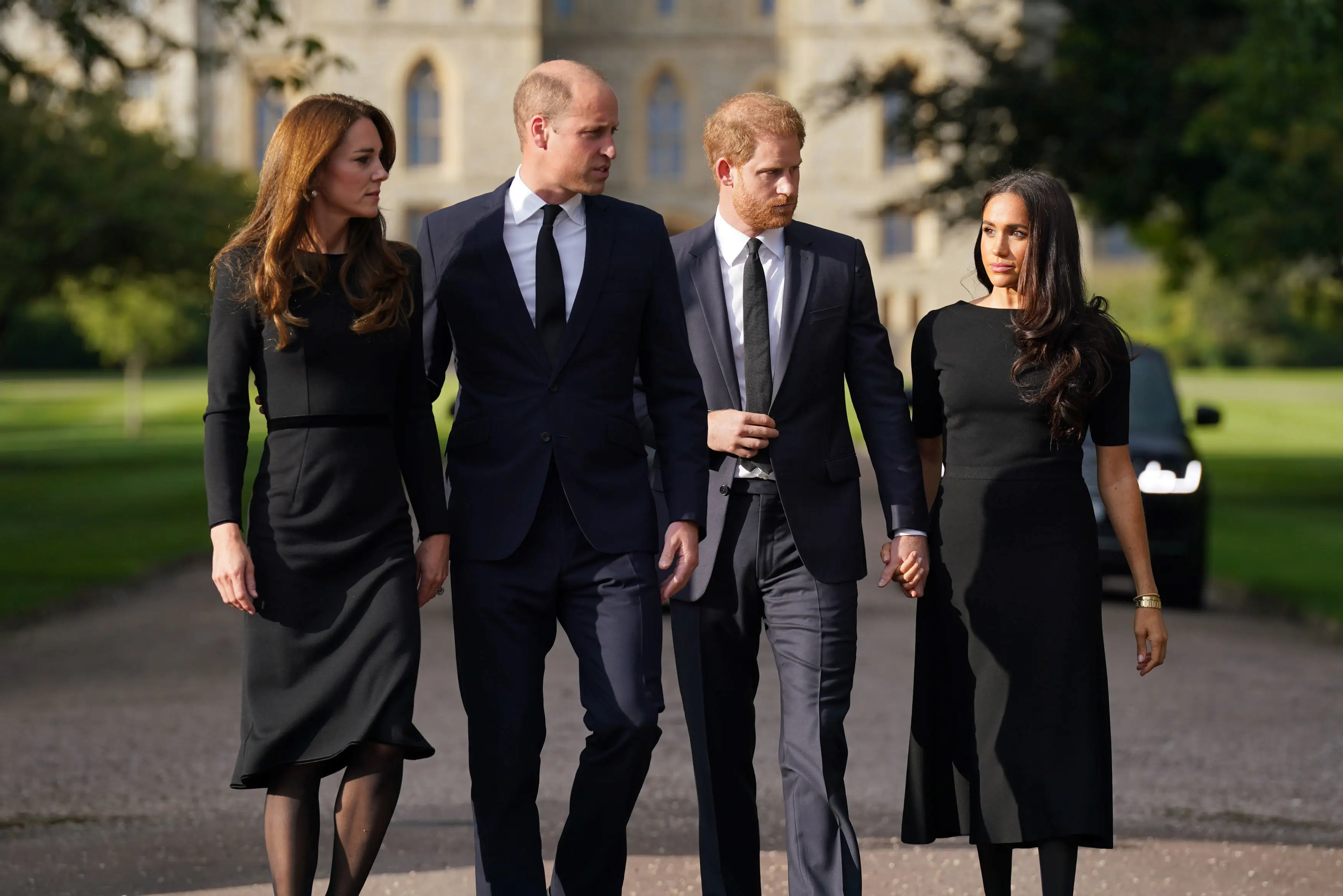 A body language expert has analysed what 'awkward' gestures between Meghan Markle and Kate Middleton mean for their relationship (Kirsty O'Connor - WPA Pool/Getty Images)