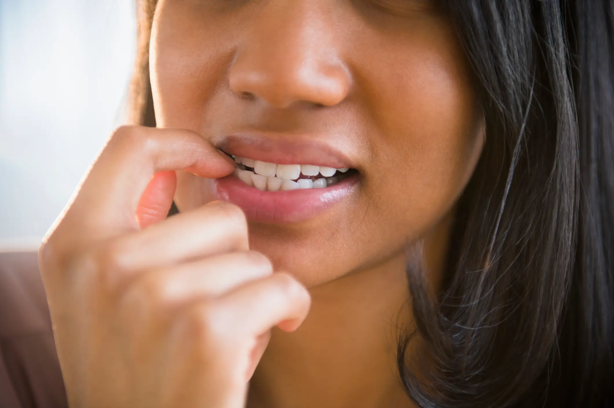 There are a number of health risks linked to nail biting (JGI/Jamie Grill / Getty Images)