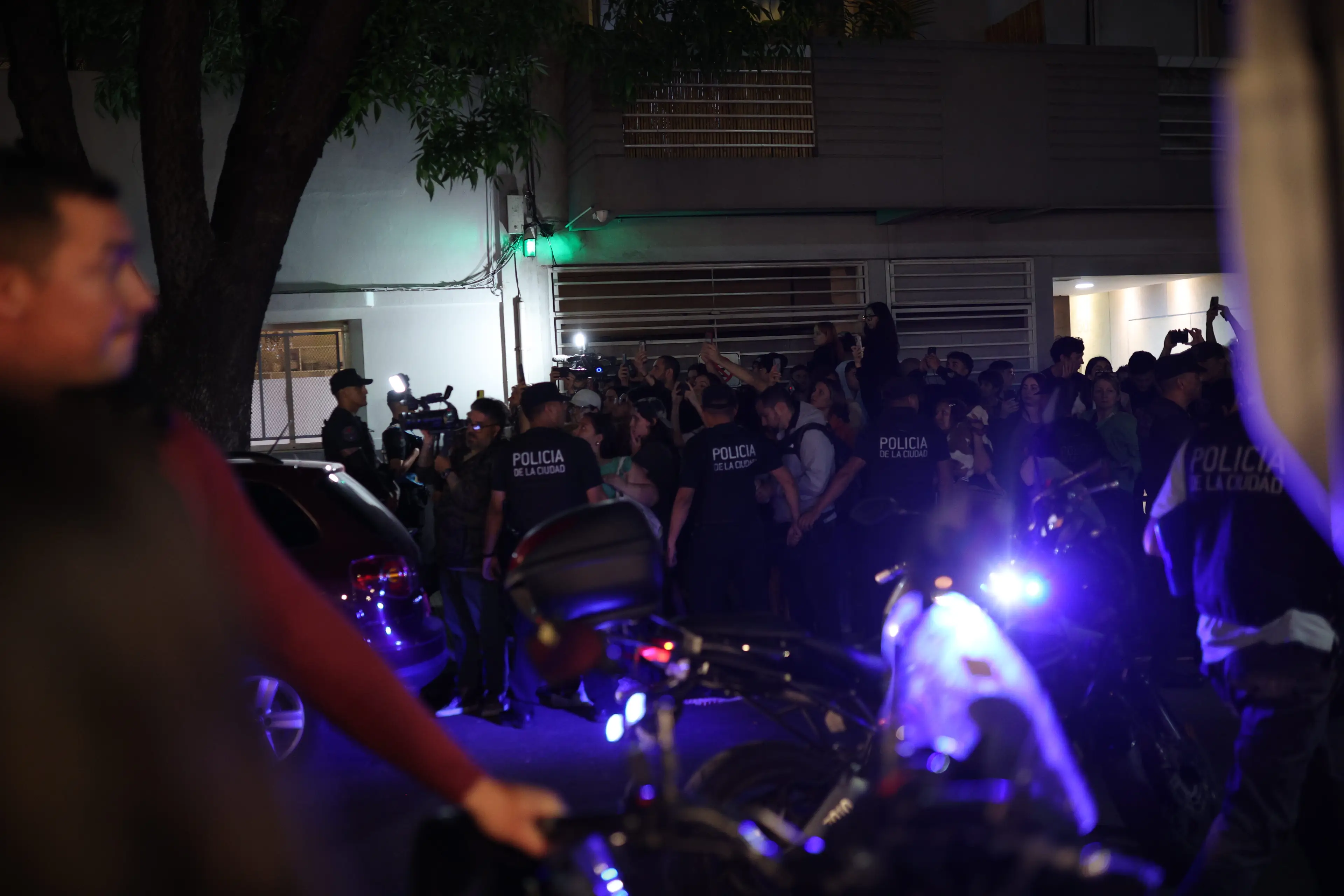 The authorities were on scene to investigate, as well as hoards of fans who flocked to the hotel to pay their respects (Luciano Gonzalez/Anadolu via Getty Images)