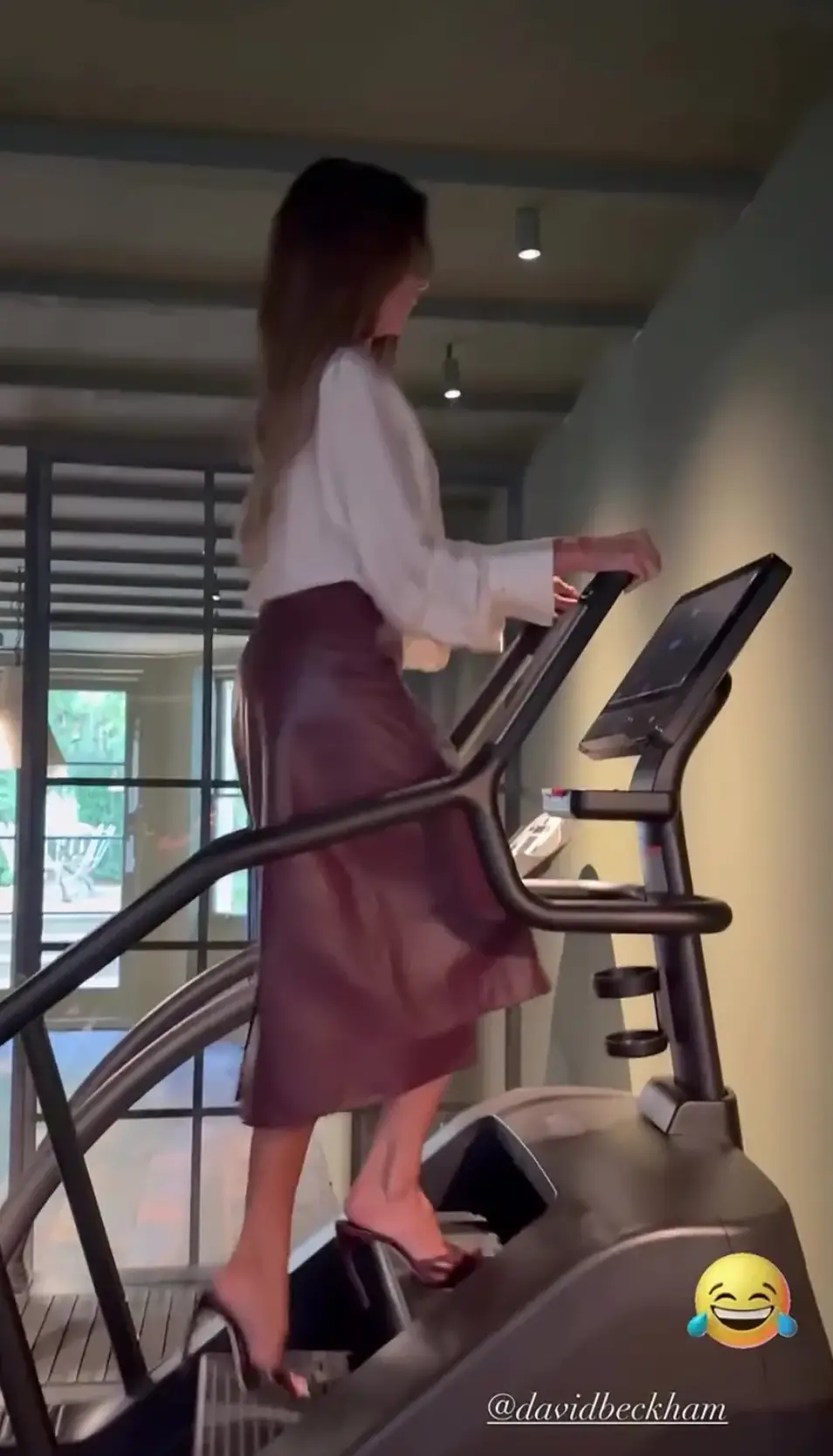 The fashion designer wore a leather burgundy skirt and white shirt to hit the gym (Instagram/VictoriaBeckham)