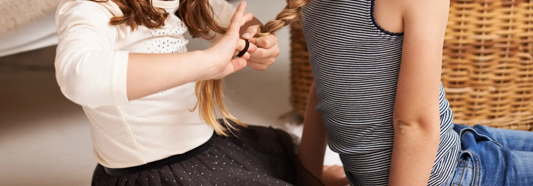 Hair-twirling can be a sign of masking in an autistic person (PeopleImages / Getty Images)