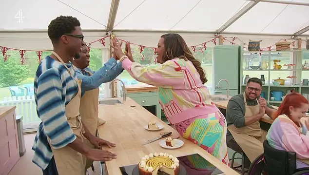 Moyin received a Hollywood handshake for his bake, helped by his mum (Channel 4)