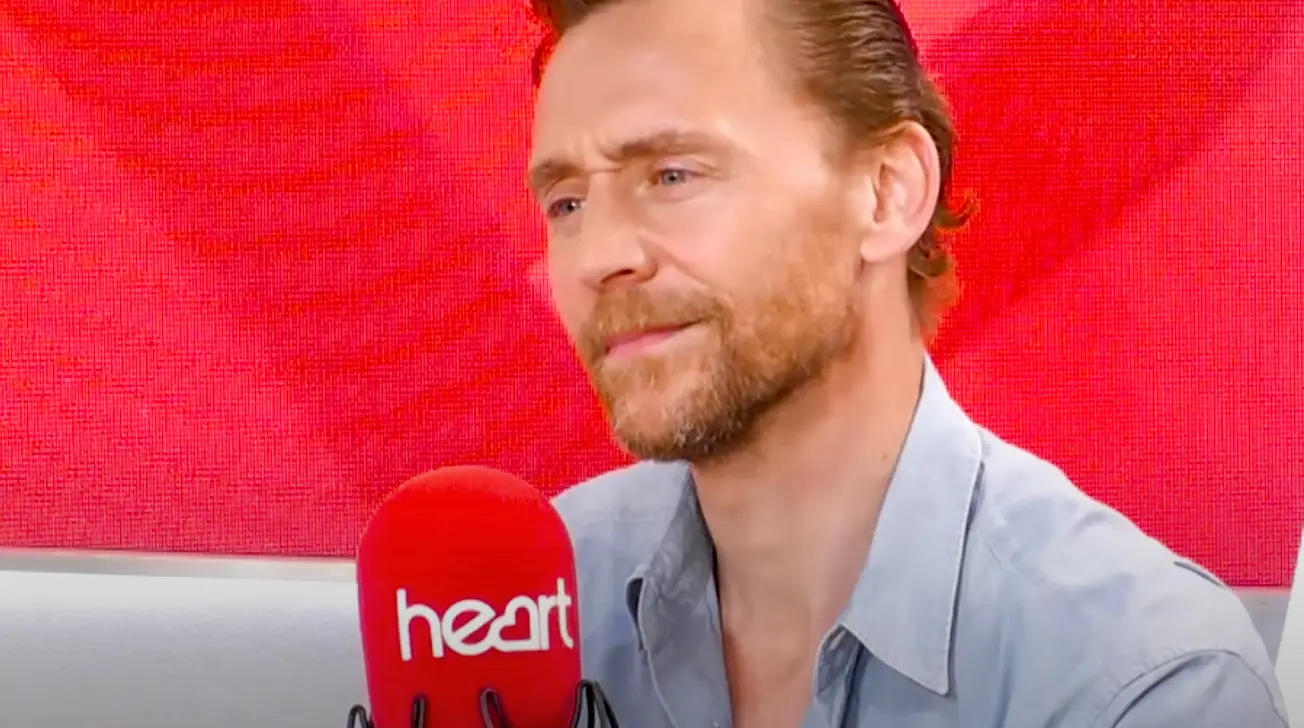 Hiddleston looked pretty confused at first (YouTube/Heart)