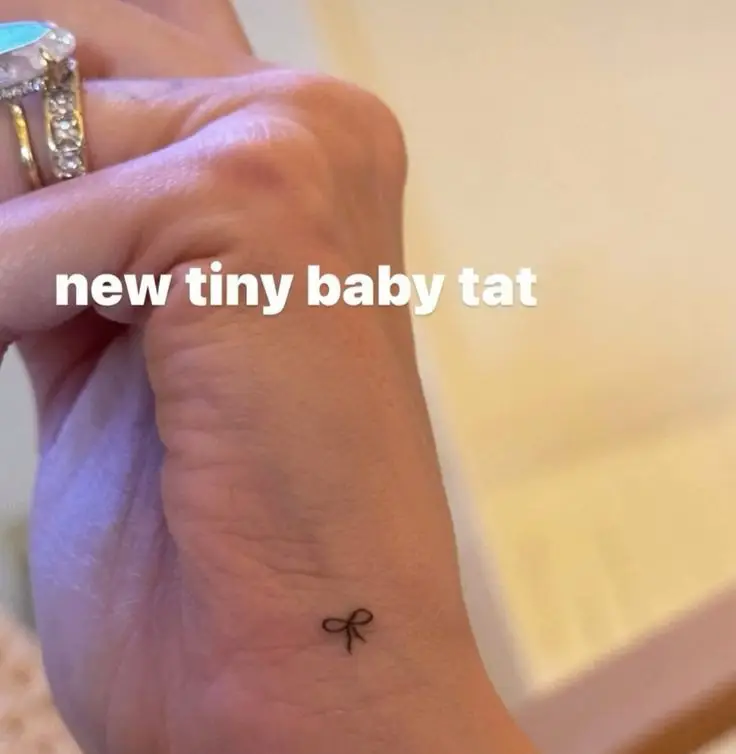 Hailey celebrated her pregnancy with a bow tattoo. (Instagram/@haileybieber)