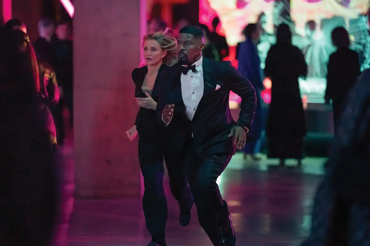 Jamie Foxx and Cameron Diaz running while dressed to impress in their latest Hollywood action movie (Netflix/John Wilson)