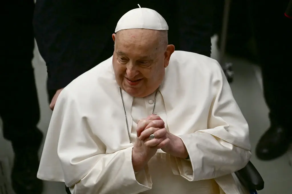 Pope Francis greets people at the end of the weekly general audience on February 12 - just two days before he was admitted to hospital (FILIPPO MONTEFORTE/AFP via Getty Images)