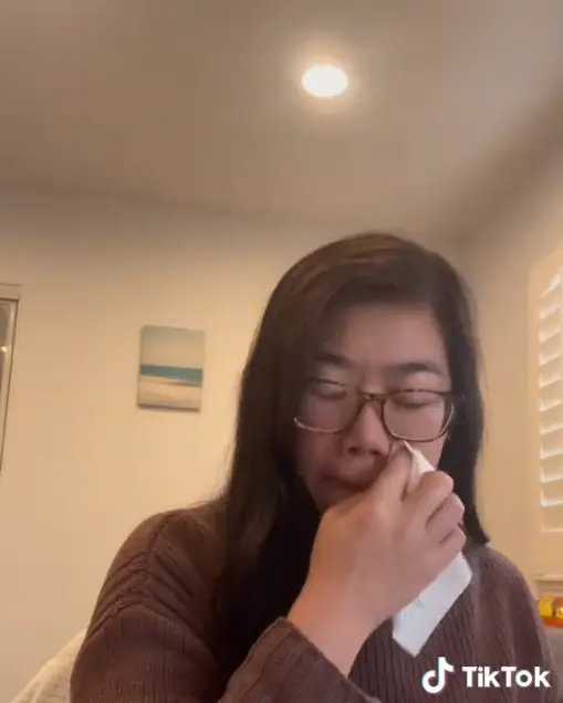 The woman wiped away tears when she found out she had been made redundant.