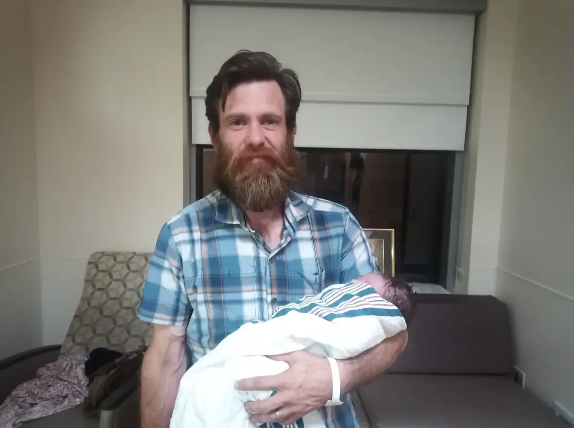 The former actor with his newborn (Twitter)