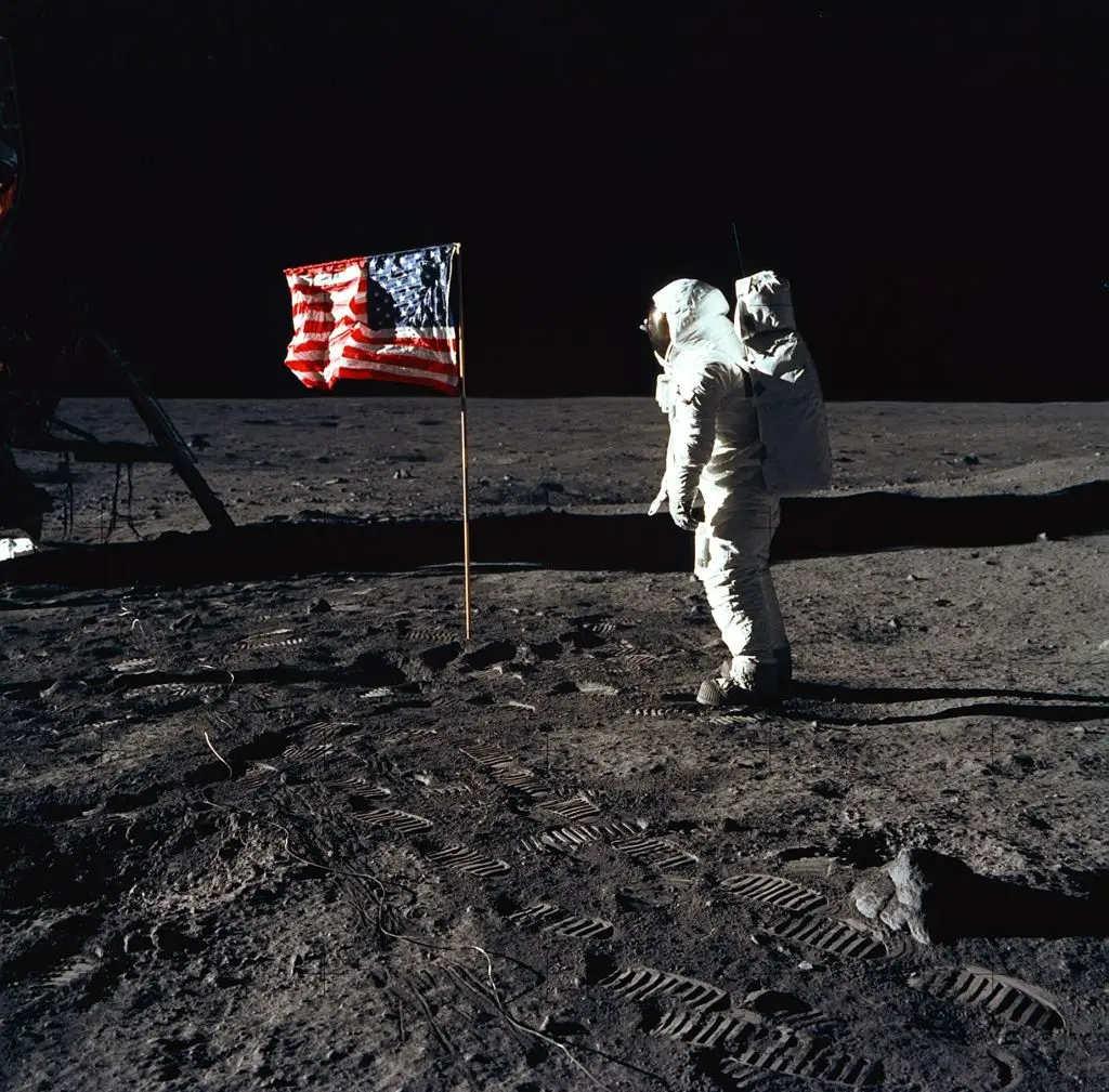 Buzz Aldrin stands next to the US flag during his and Neil Armstrong's moon walk, with the pair becoming the first people to land on the moon (NASA/Newsmakers)
