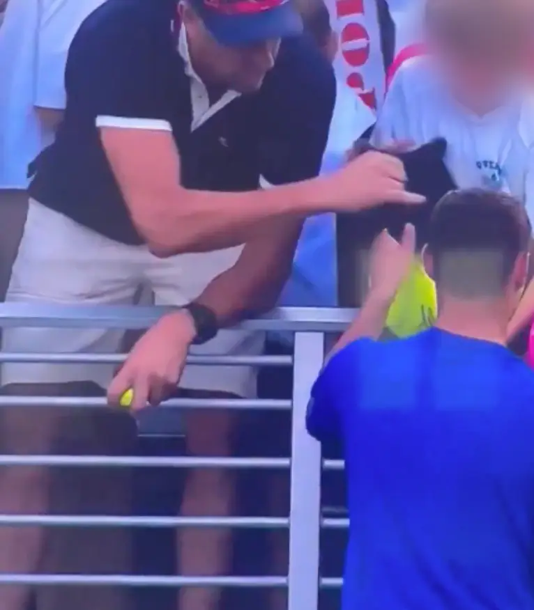 While the tennis player was distracted, a man stole the cap from a child (USTA)