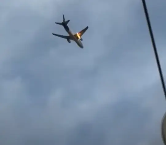 The FedEx plane's engine burst into flames (YouTube/CBS Evening News)