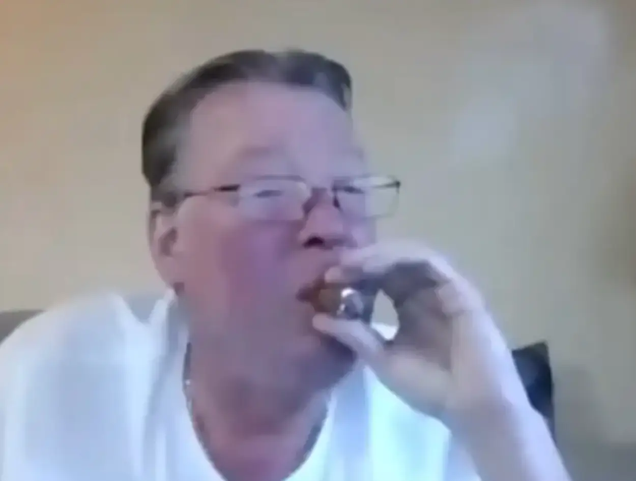 Charles Komoroski was enjoying a cigar as he spoke with his criminal daughter (Charleston County Sheriff's Office)