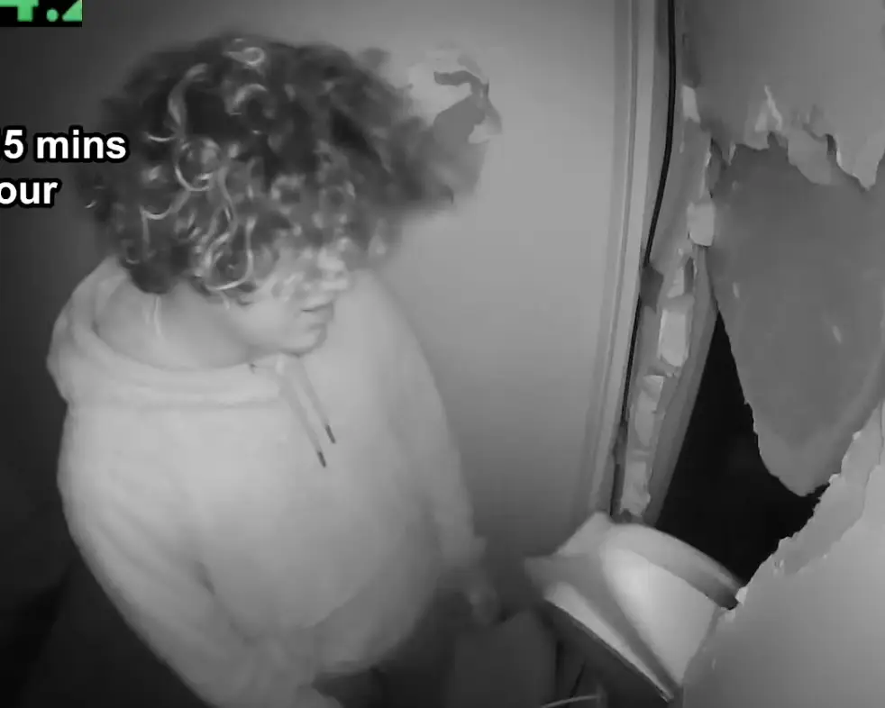 Norme can be seen pacing around the room (YouTube)