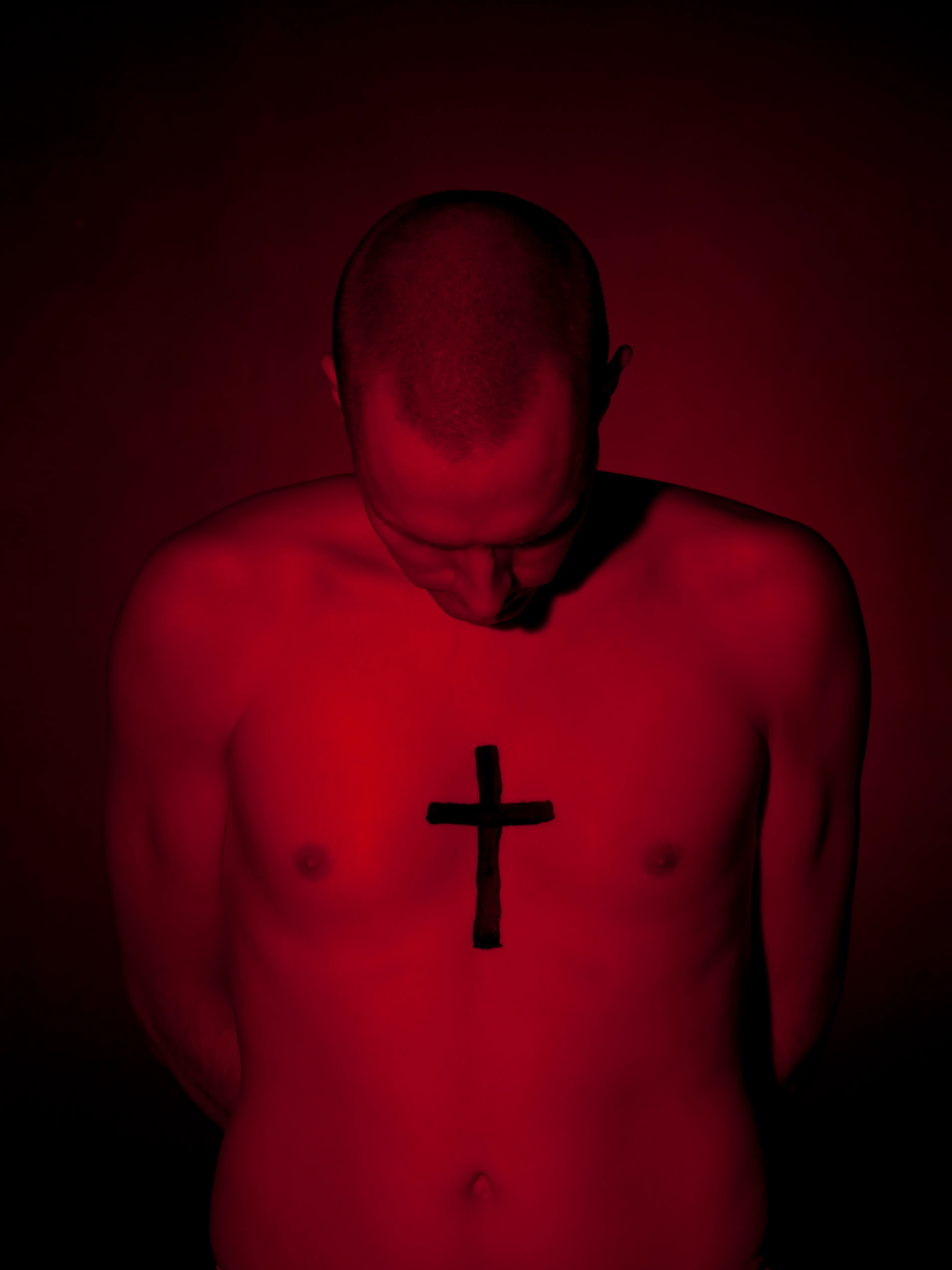A cross on the chest has a hidden prison meaning (Getty Stock Photo)