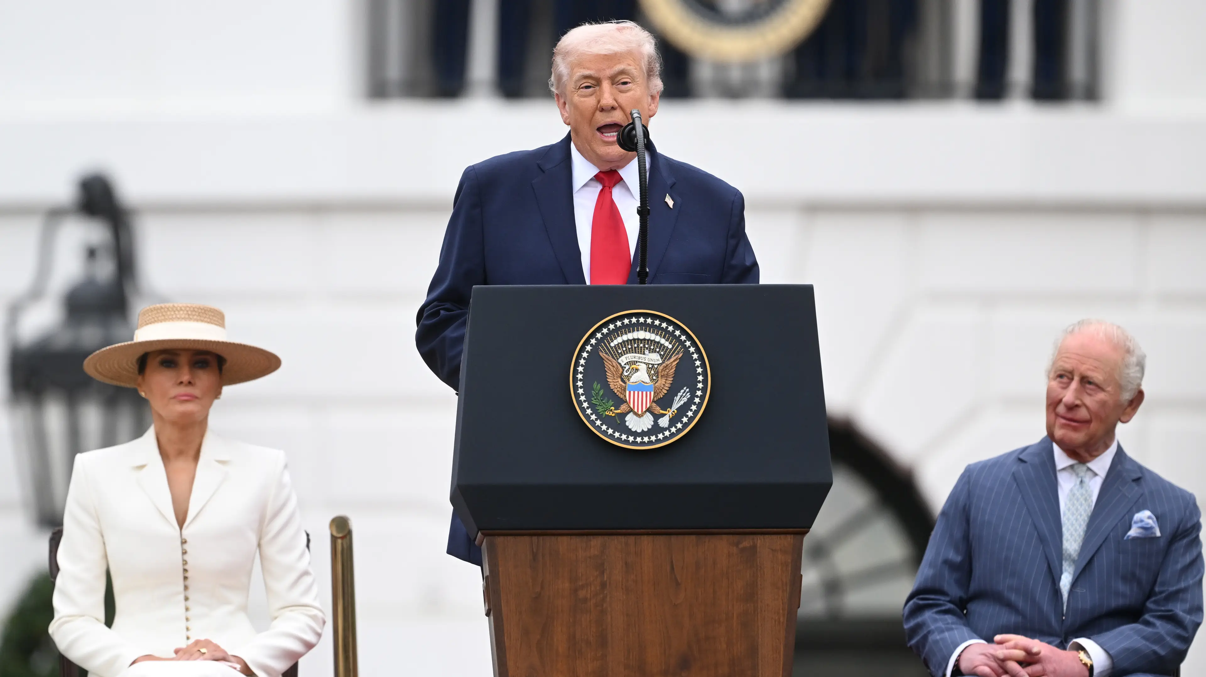 King Charles III and First Lady Melania Trump look on while U.S. President Donald Trump speaks on stage during a state arrival ceremony on the South Lawn of the White House  (Samir Hussein / Getty Images)