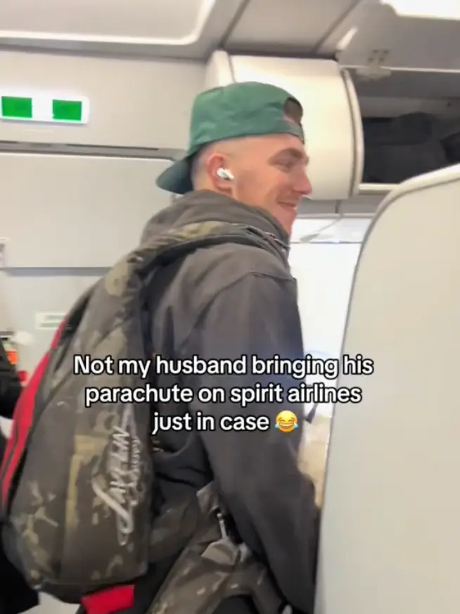 Brooks recorded her husband boarding the plane with his parachute on his back.