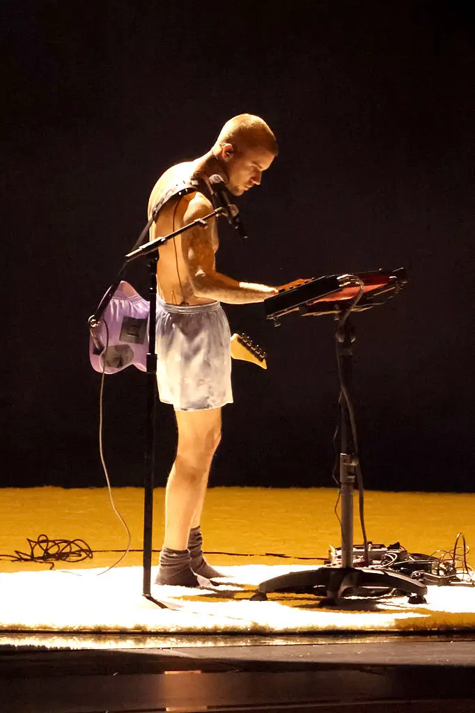 Justin Bieber kept his clothing to a minimum for his performance (JC Olivera/WireImage)