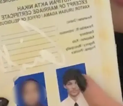 The fan presented Tomlinson with a marriage certificate (TikTok/@ladycryalot)