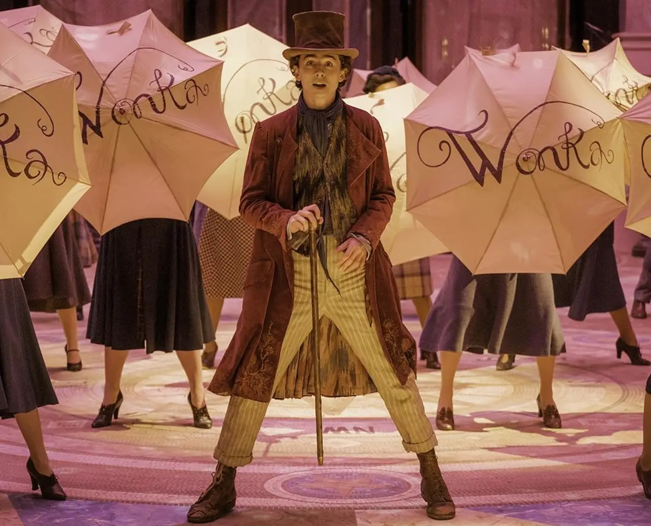 Chalamet fits Wonka's purple coat and top hat perfectly.