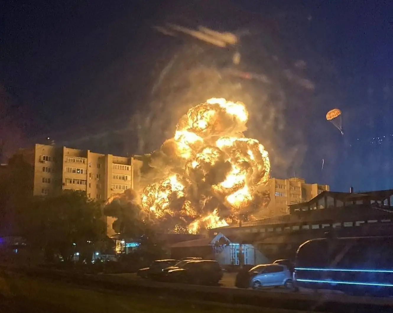 The impact of the plane crash was pictured and the pilots were spotted parachuting to safety.