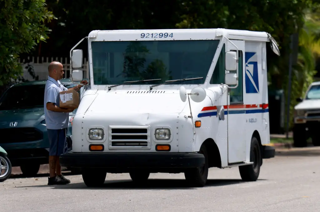 The USPS carries packages on the 'last mile' of their journey for millions of rural Americans (Joe Raedle/Getty Images)