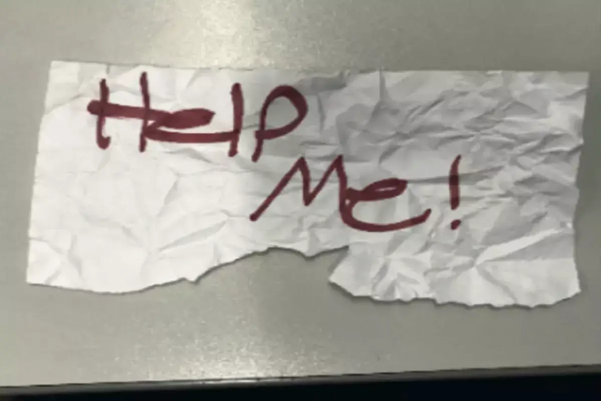 The note written by the 13-year-old girl which led to her rescue outside a laundromat in Long Beach (US Department of Justice)