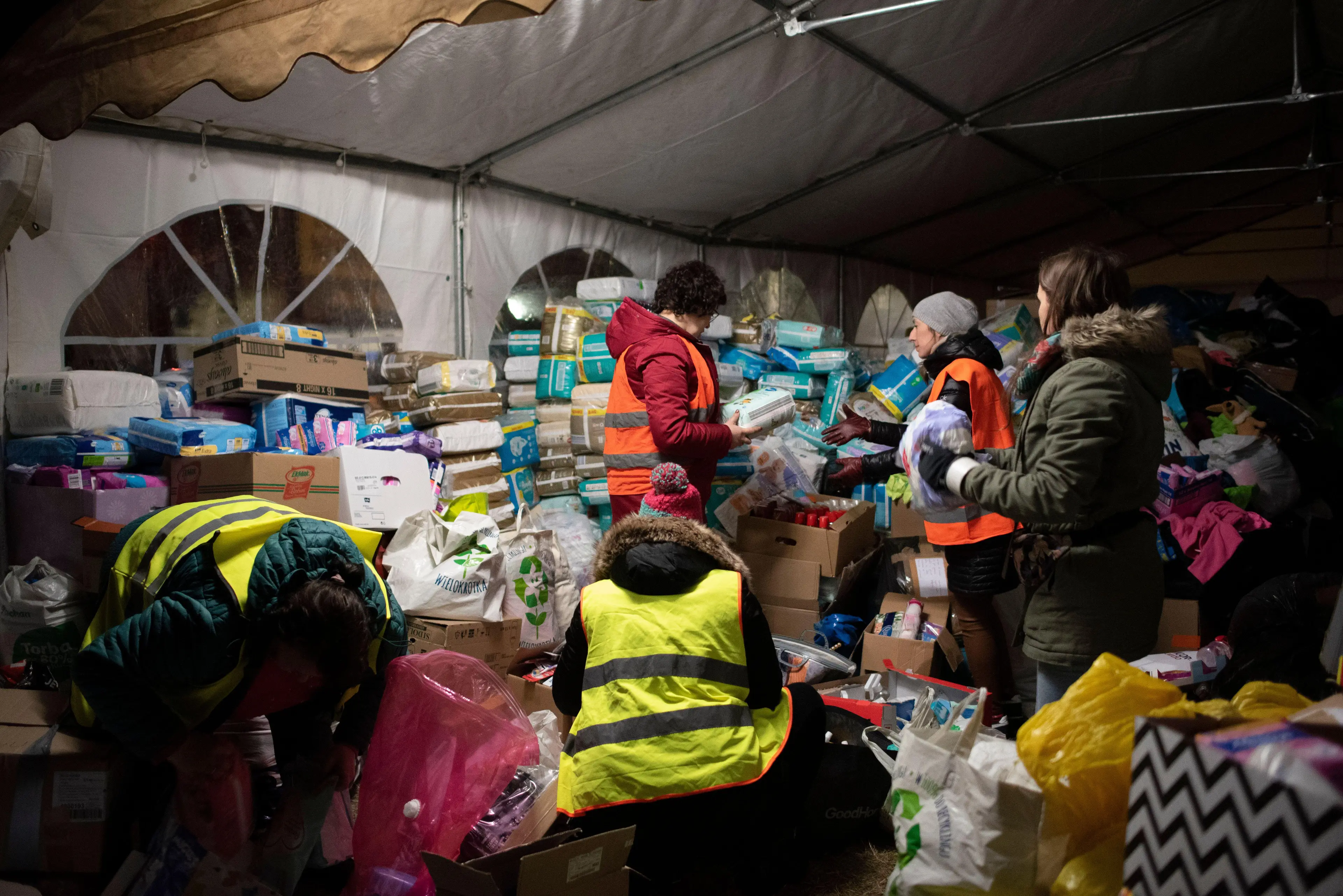 Volunteers sort first necessity goods at the reception point in Przemysl, Poland (Alamy)