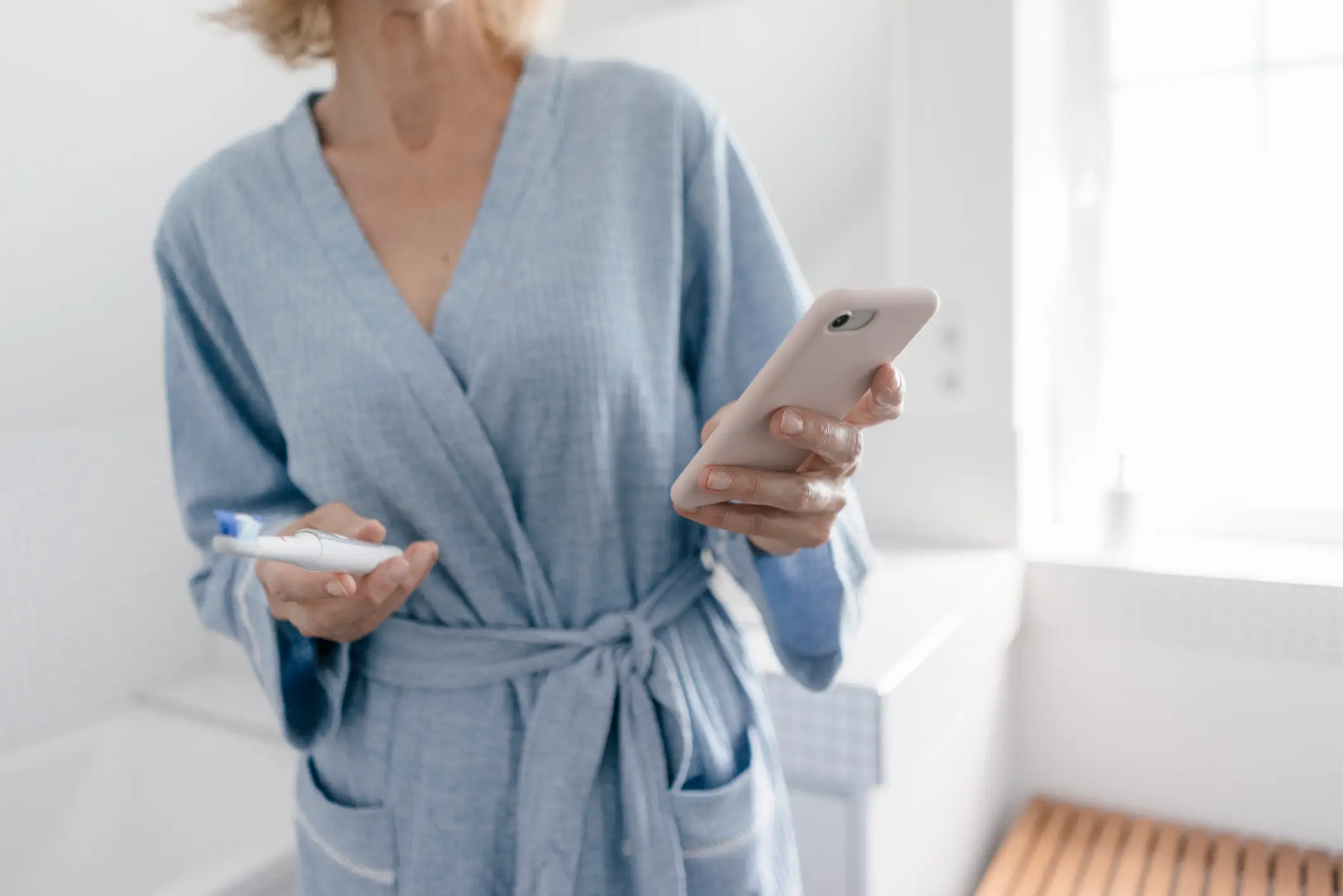It's not uncommon for people to take their devices into the bathroom with them (Getty Stock)