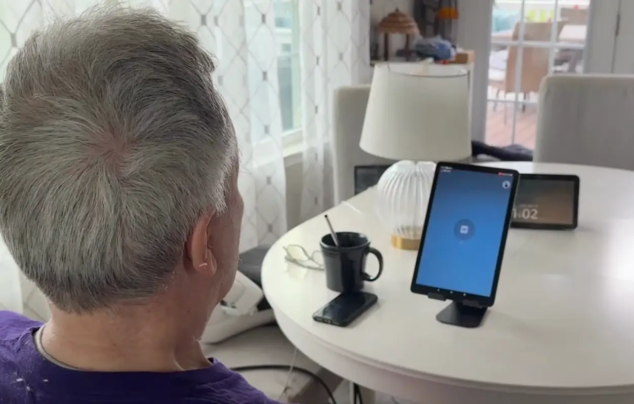 Mark was able to control lights and music with his brain (YouTube/Synchron)