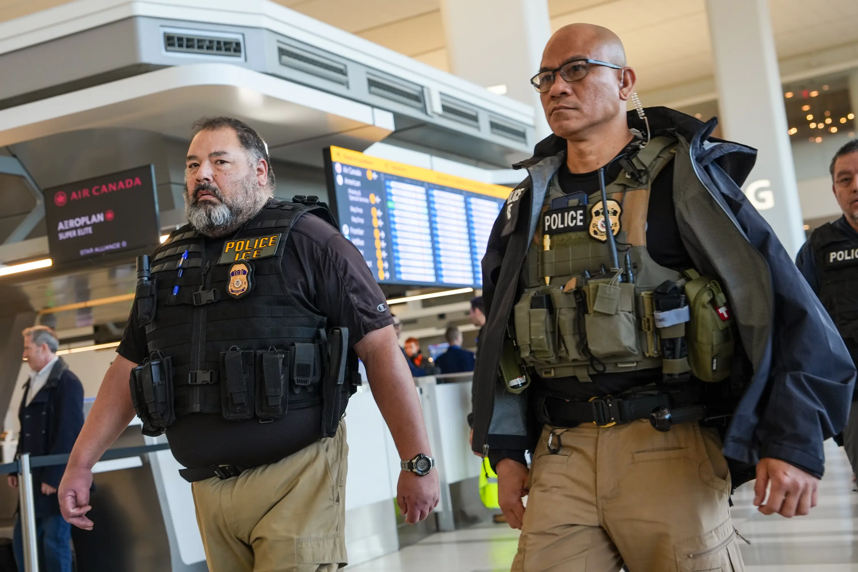 With the federal government shutdown making delays even worse, President Trump ordered the redeployment of ICE agents to airports across the country(Ryan Murphy/Getty Images)