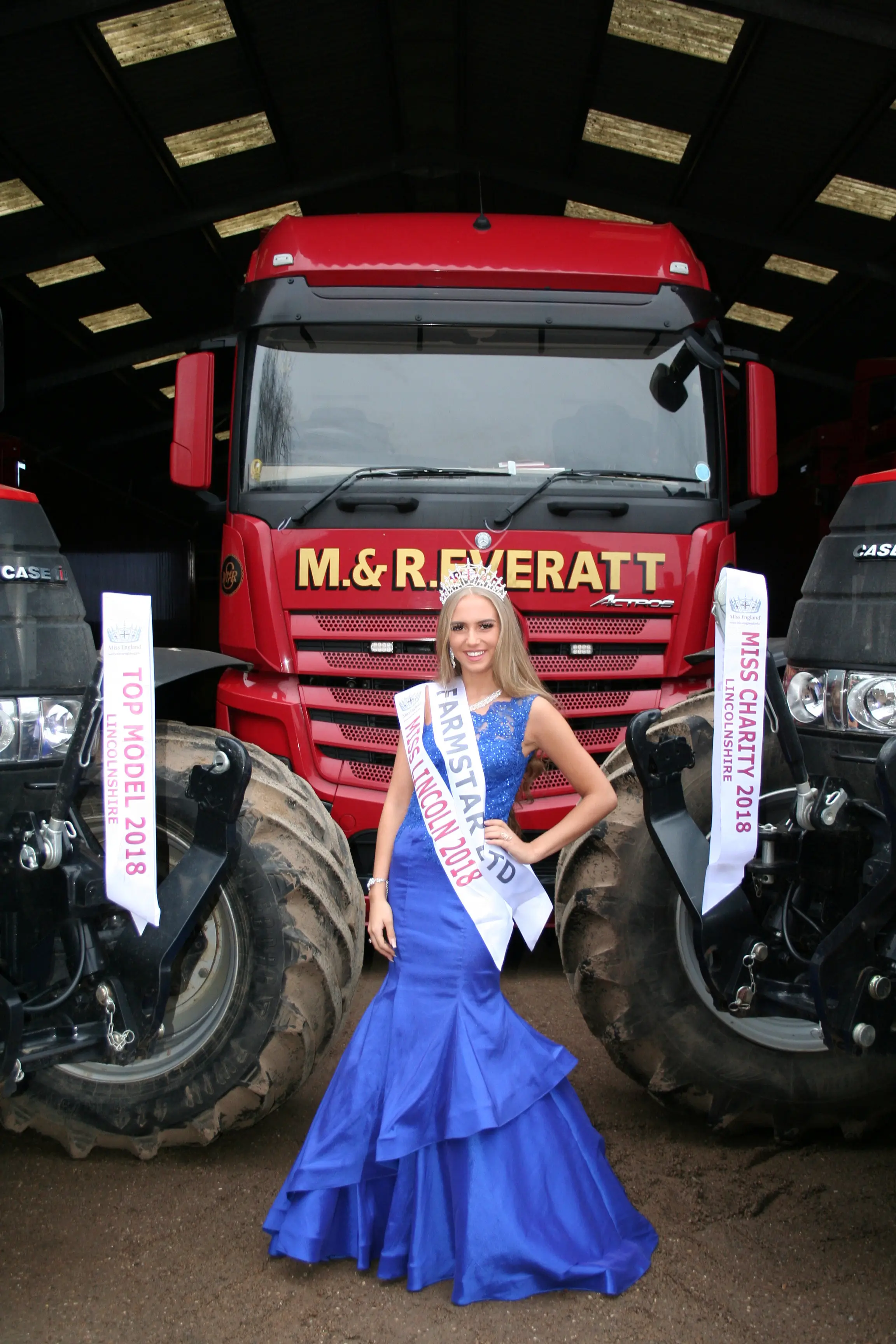Miss England finalist Milly Everatt in front of lorry (SWNS)