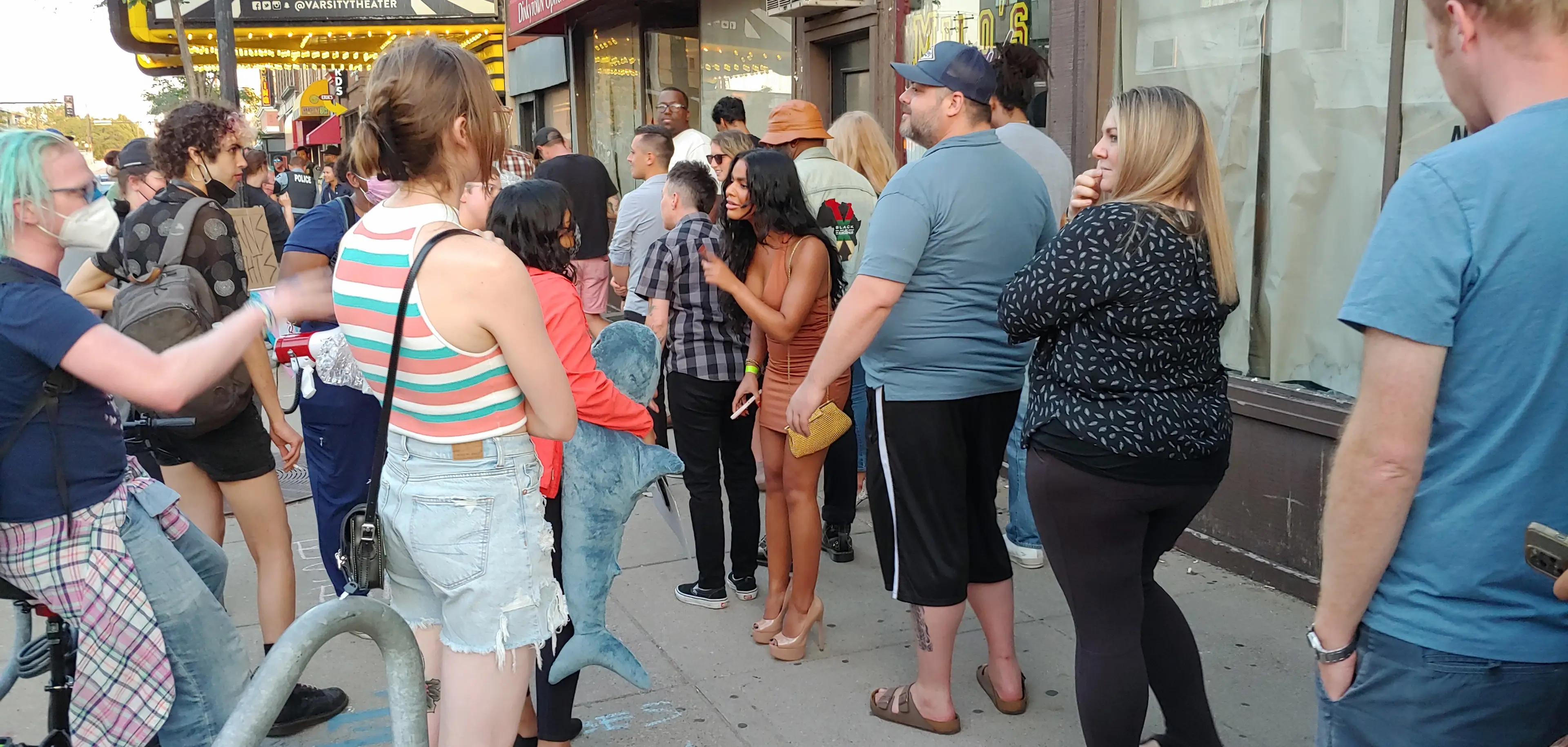A woman in line for Dave Chappelle's show gets into a debate with a protester.