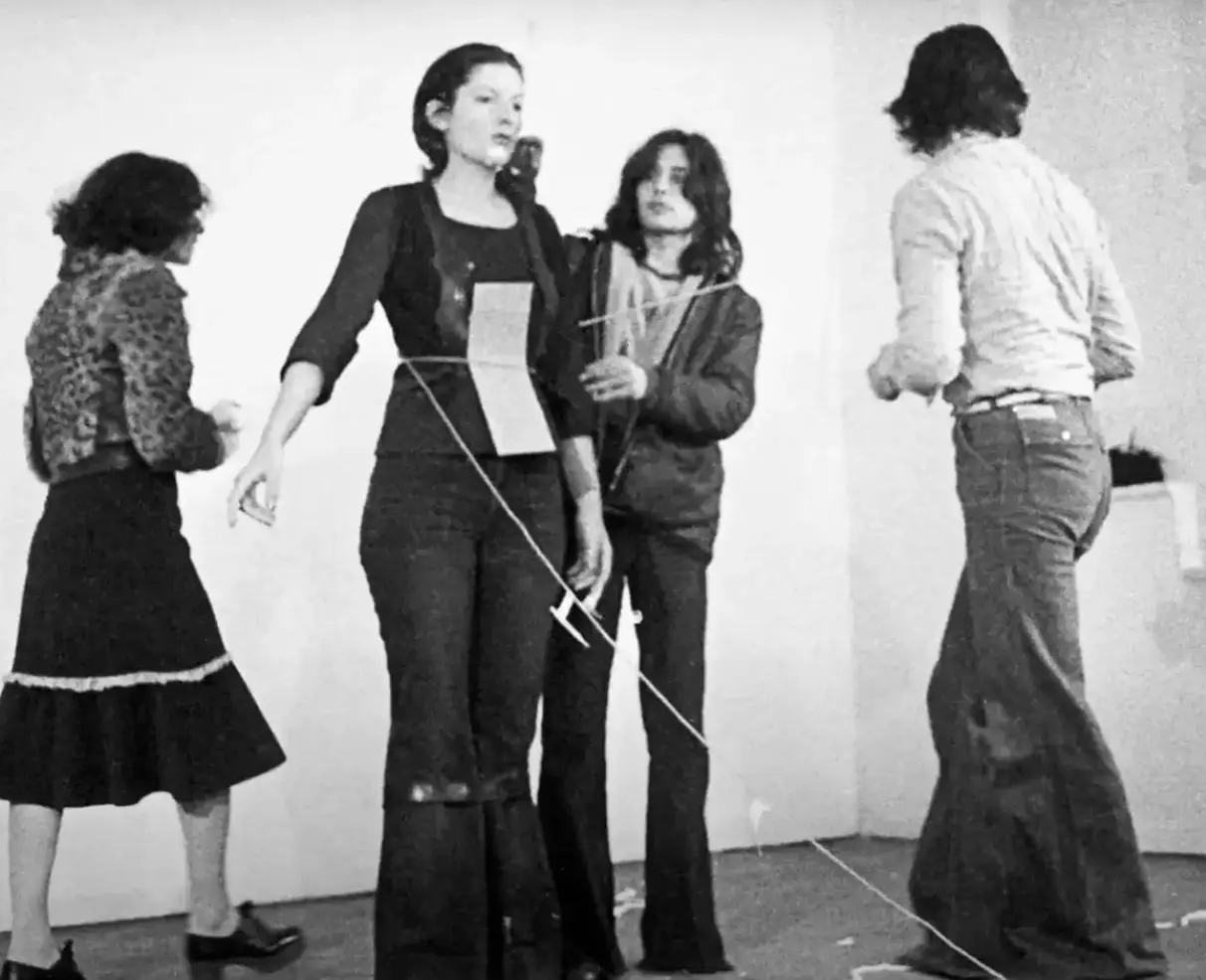 Marina placed everything from flowers to guns for people to use (YouTube/Marina Abramovic Institute)