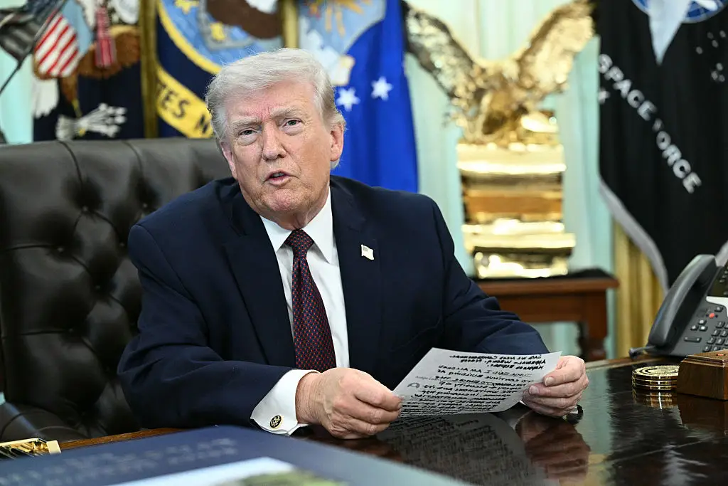 The president was not too careful with his notes (Brendan SMIALOWSKI/AFP via Getty Images)