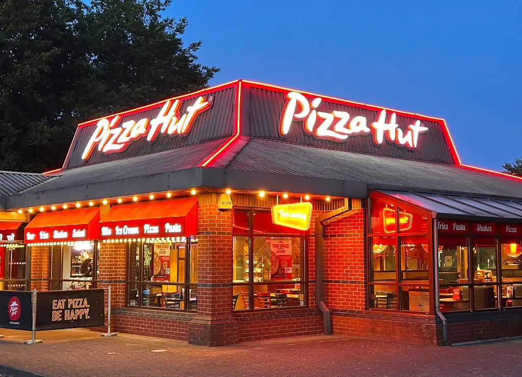 Pizza Hut is temporarily rebranding as 'Hut' for 25 weeks to coincide with football season. (Photo by Peter Dazeley/Getty Images)