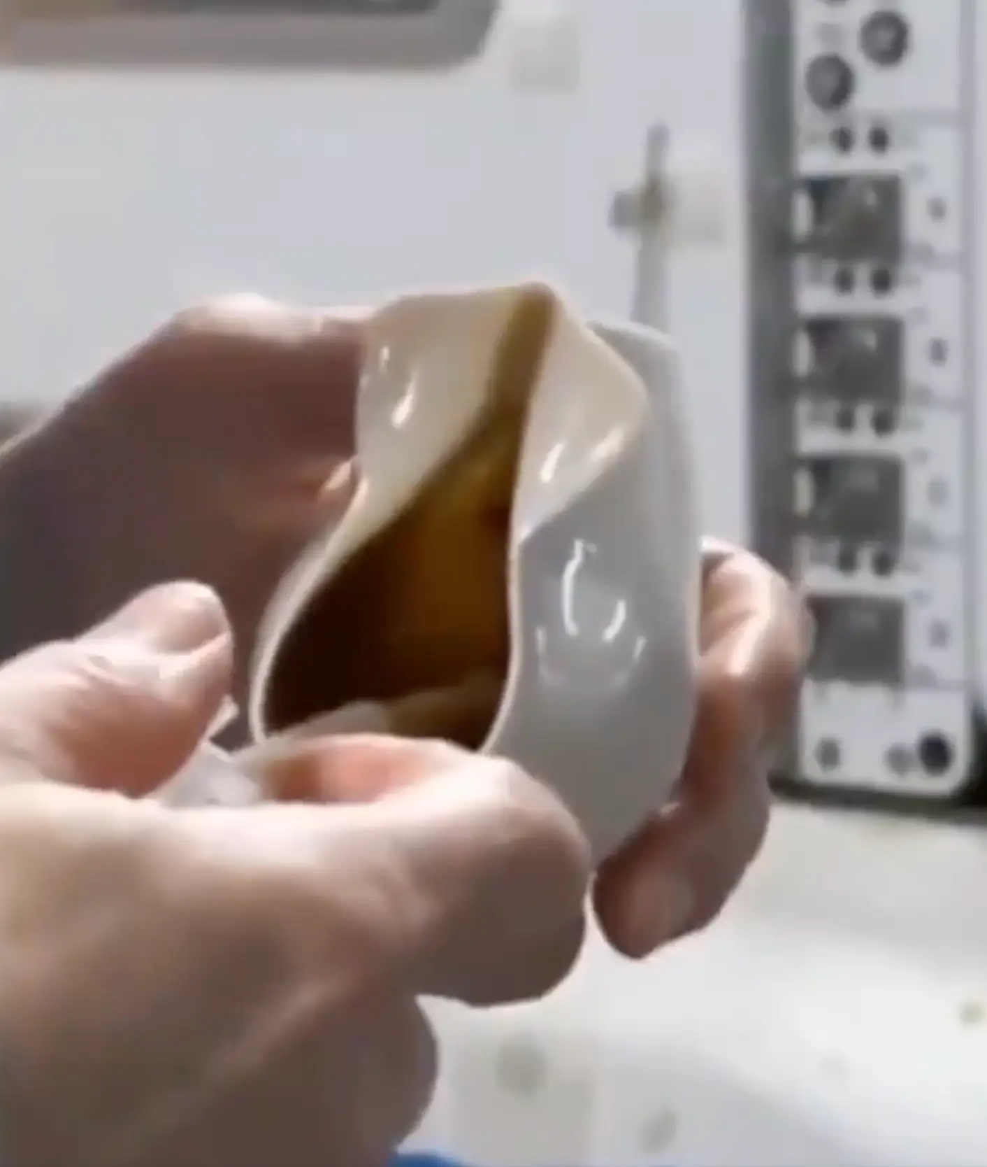 The coffee cup is designed to never spill in space but you see what we see, right? (Don Pettit)