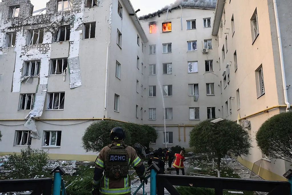 Firefighters extinguish a fire caused by a Russian drone strike on the top floor of a multi-story residential building in Kharkiv, Ukraine, yesterday  (Ukrinform/NurPhoto via Getty Images)