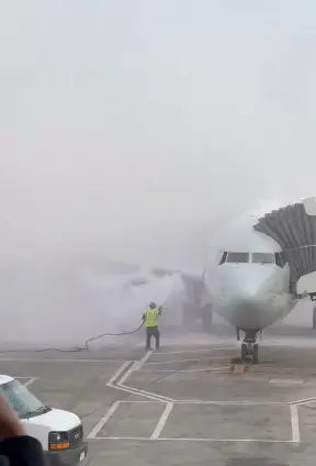 Firefighters doused the jet in water while some passengers were taken to hospital (Twitter/@flynnstone)