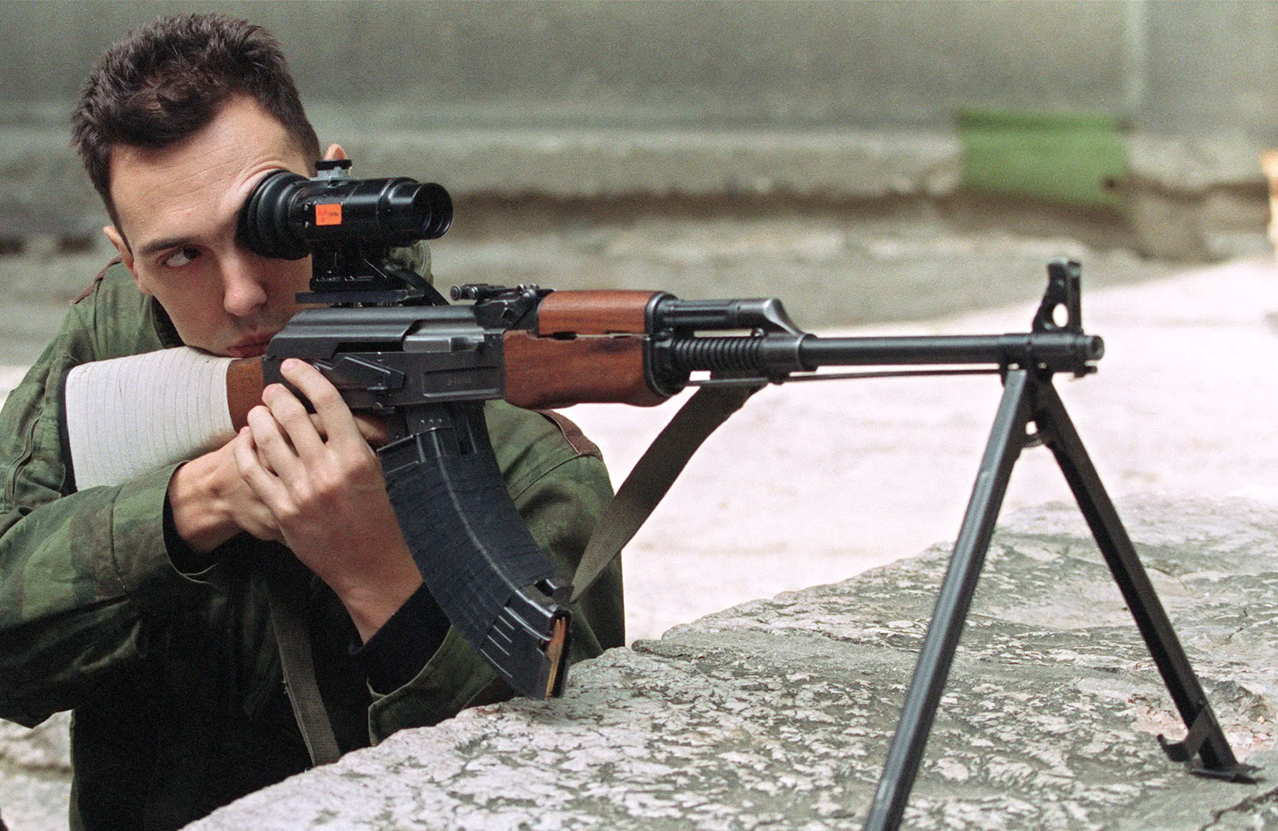 A sniper taking aim in Sarajevo (MICHAEL EVSTAFIEV/AFP via Getty Images)