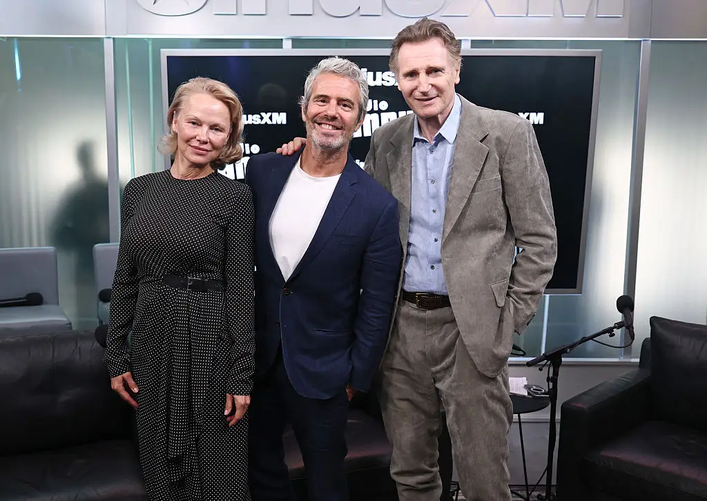 Pamela Anderson, Andy Cohen, and Liam Neeson pictured on July 30 (Cindy Ord/Getty Images for SiriusXM)